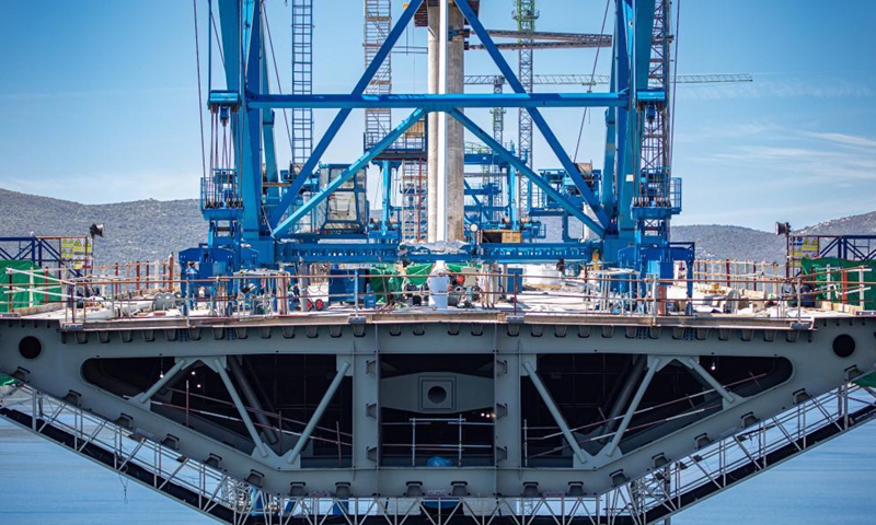 Photo taken on May 10, 2021 shows the construction site of the Peljesac Bridge near Komarna, Croatia. In January 2018, a Chinese consortium led by the China Road and Bridge Corporation (CRBC) won the bid for the first phase of the bridge and its access roads. Construction started six months later. The construction of the Peljesac Bridge will be completed in June 2022.  Photo: Xinhua