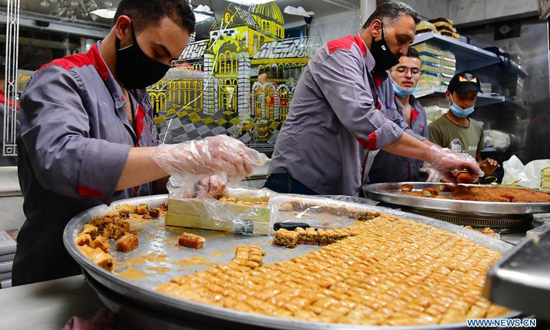 Sweet makers prepare traditional Syrian sweets for the upcoming Eid al-Fitr in Damascus, Syria, on May 9, 2021. Eid al-Fitr marks the end of the Islamic holy month of Ramadan.(Photo: Xinhua)