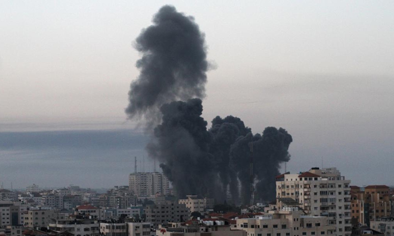 Smoke rises following Israeli airstrikes in Gaza City, May 12, 2021. The tit-for-tat trade of fire between militant groups in the Gaza Strip and Israel was mounting on Tuesday, leaving 28 Palestinians and three Israelis killed and dozens of others wounded from both sides.  Photo: Xinhua