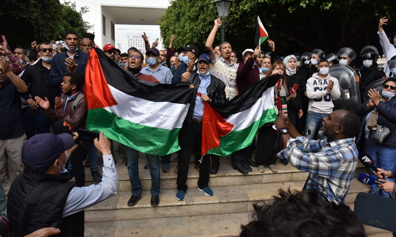 Moroccan protesters wave Palestine flags and shout anti-Israeli slogans during a rally in Rabat, Morocco, on May 10, 2021.(Photo: Xinhua)