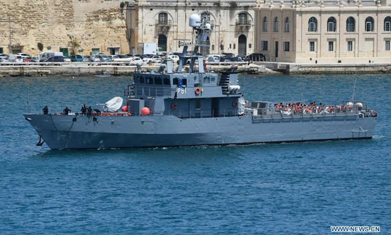 Migrants are shipped to land by the Armed Forces of Malta, in Senglea, south of Malta, on May 11, 2021. A group of around 70 migrants were brought to Malta after being rescued in south of the island during Monday night following a distress call, a spokesperson from the Ministry for Home Affairs, National Security and Law Enforcement, said on Tuesday.(Photo: Xinhua)