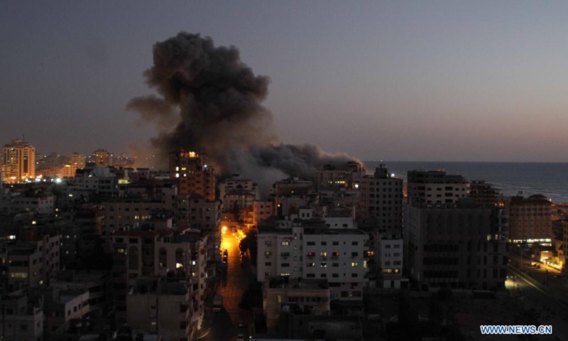 Photo taken on May 11, 2021 shows explosions following Israeli air strikes in Gaza City. Israeli military chief Aviv Kochavi decided on Tuesday to extend Israel's offensive in the Gaza Strip with no time limit amid the tensions with Hamas, a Palestinian movement that runs the strip. Three women in Israel and 28 people in Gaza Strip have been reportedly killed since Monday in the worst flare-up of Israeli-Palestinian violence since Israel's major military assault in Gaza in 2014.(Photo: Xinhua)