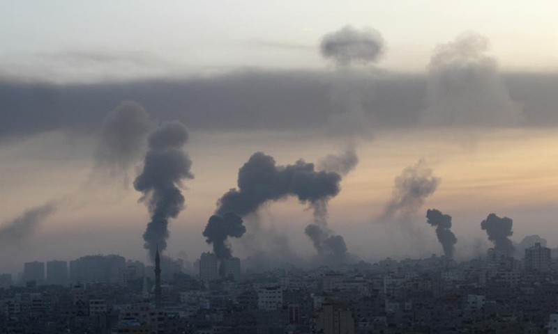Smoke rises following Israeli airstrikes in Gaza City, May 12, 2021. The tit-for-tat trade of fire between militant groups in the Gaza Strip and Israel was mounting on Tuesday, leaving 28 Palestinians and three Israelis killed and dozens of others wounded from both sides.   Photo: Xinhua