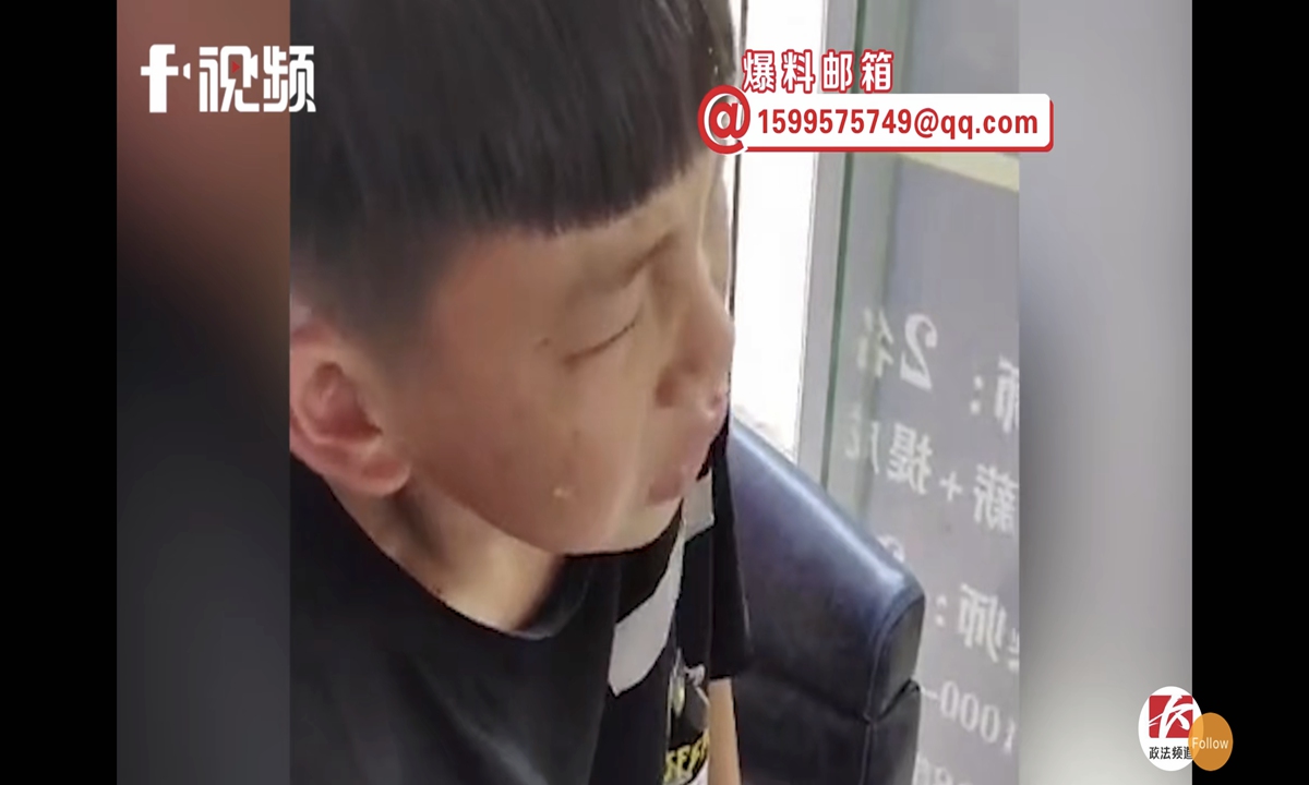 A video circulating on Sina Weibo, China's Twitter-like platform, shows the boy looking in the mirror repeatedly with a dissatisfied expression after getting a haircut at a barbershop. He then let out a loud cry, kept running his hands through his hair, and then called the police. Photo: Sina Weibo
