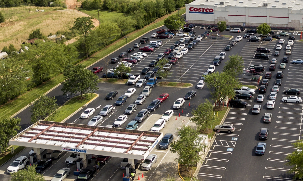 In this aerial image taken with a drone, numerous vehicles line up for gasoline at Costco on Wendover Avenue in Greensboro, N.C., on Tuesday, May 11, 2021. Photo: VCG