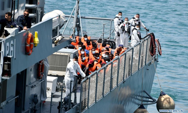 Migrants are brought back to land by the Armed Forces of Malta, in Senglea, south of Malta, on May 11, 2021. A group of around 70 migrants were brought to Malta after being rescued in south of the island during Monday night following a distress call, a spokesperson from the Ministry for Home Affairs, National Security and Law Enforcement, said on Tuesday.(Photo: Xinhua)