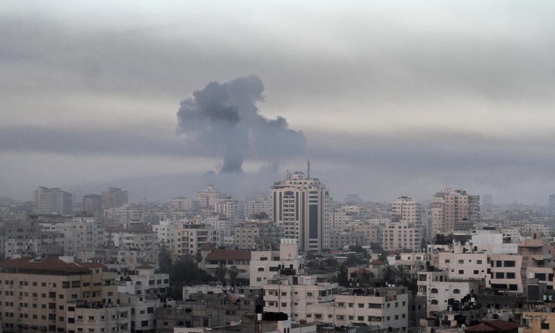 Smoke rises following Israeli airstrikes in Gaza City, May 12, 2021. The tit-for-tat trade of fire between militant groups in the Gaza Strip and Israel was mounting on Tuesday, leaving 28 Palestinians and three Israelis killed and dozens of others wounded from both sides.   Photo: Xinhua
