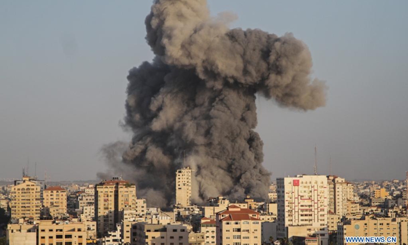 Heavy smoke rises following an Israeli air strike in central Gaza City, on May 12, 2021. The second day of fighting between Israel and the Hamas militant group ruling the Gaza Strip left massive damage in Gaza and an increasing number of casualties on both sides on Wednesday.(Photo: Xinhua)