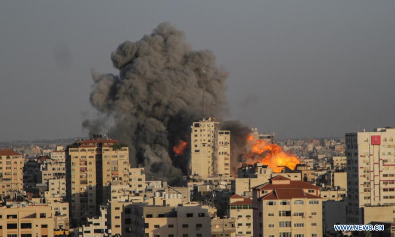Heavy smoke rises following an Israeli air strike in central Gaza City, on May 12, 2021. The second day of fighting between Israel and the Hamas militant group ruling the Gaza Strip left massive damage in Gaza and an increasing number of casualties on both sides on Wednesday.(Photo: Xinhua)