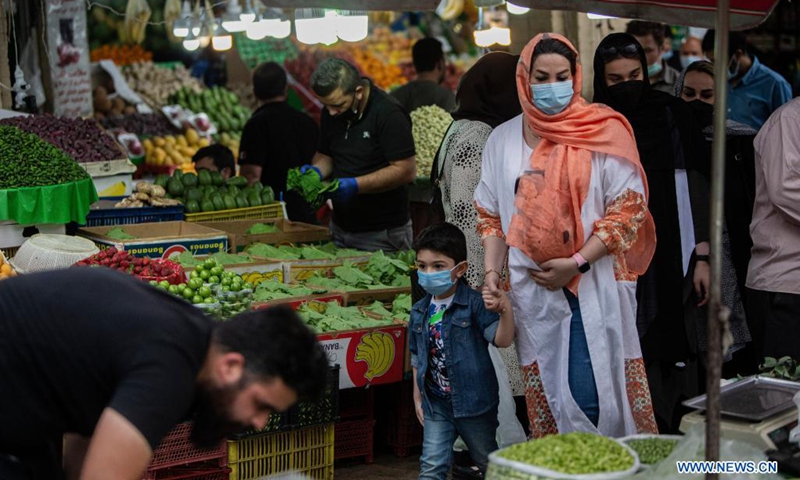 People shop at a bazaar ahead of the upcoming Eid al-Fitr in Tehran, Iran, on May 12, 2021. Eid al-Fitr marks the end of the Islamic holy month of Ramadan.(Photo: Xinhua)