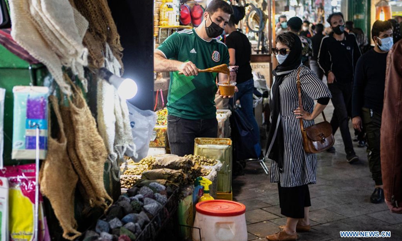 People shop at a bazaar ahead of the upcoming Eid al-Fitr in Tehran, Iran, on May 12, 2021. Eid al-Fitr marks the end of the Islamic holy month of Ramadan.(Photo: Xinhua)