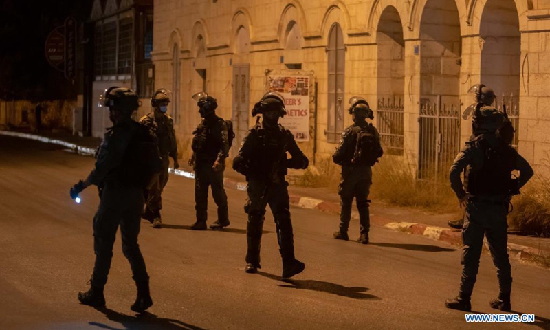 Members of Israeli border police take positions during an anti-Israel protest against the violence in Jerusalem, in the West Bank city of Bethlehem, on May 12, 2021. Tension between Israelis and Palestinians has been flaring up over the past few days amid the escalating violence.(Photo: Xinhua)