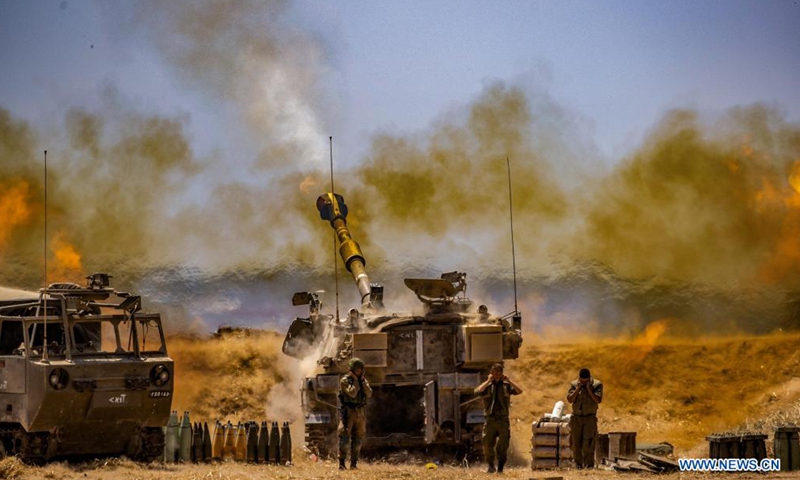 Israeli Artillery Corps fire into the Gaza Strip near the southern Israeli city of Sderot on May 12, 2021. At least 65 in Gaza and seven in Israel were killed by airstrikes and rockets, according to official reports. Photo: Xinhua