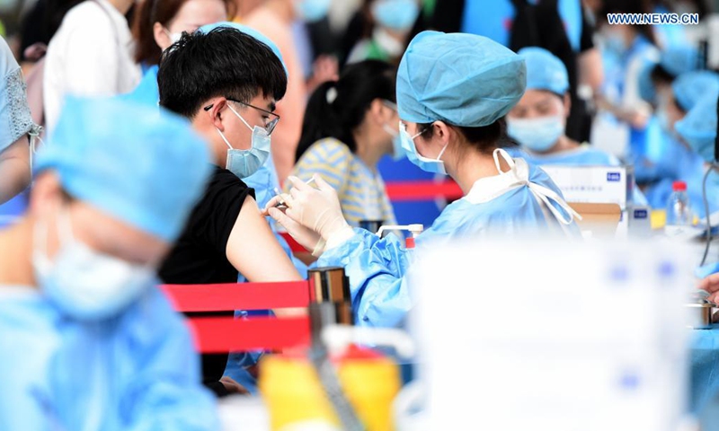 Faculty members and students receive COVID-19 vaccines at a vaccination site at Anhui Agricultural University in Hefei, east China's Anhui Province, May 13, 2021.Photo:Xinhua