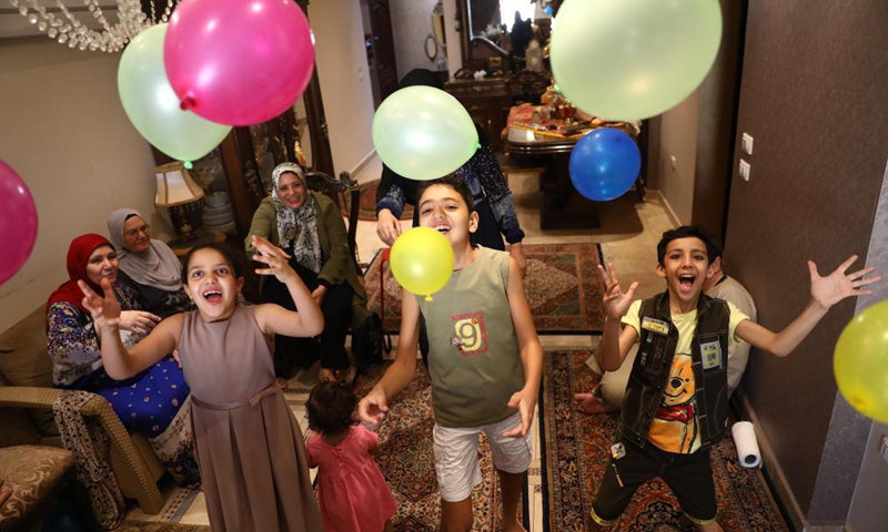 Members of an Egyptian family celebrate the Eid al-Fitr at home amid COVID-19 pandemic in Cairo, Egypt, May 13, 2021. Many Egyptians choose to celebrate the Eid al-Fitr at home as COVID-19 cases in the country continued to rise.Photo:Xinhua