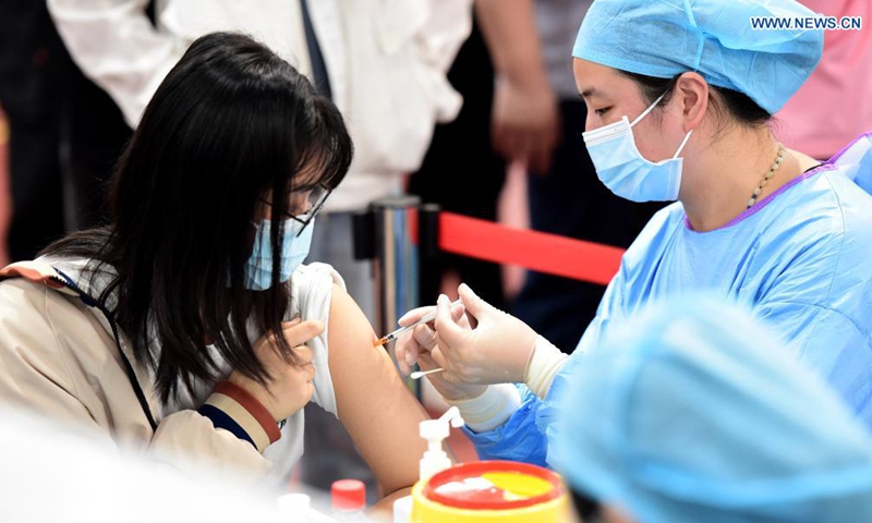 A woman receives a dose of COVID-19 vaccine at a vaccination site at Anhui Agricultural University in Hefei, east China's Anhui Province, May 13, 2021. Photo:Xinhua