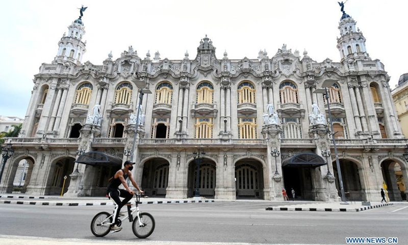 A man rides a bike on a street in Havana, Cuba, May 13, 2021. New variants of the coronavirus believed to have entered Cuba in recent months have been linked to higher transmission rates, more severe cases of disease and an increase in deaths in the Caribbean country, the official daily Granma said on Thursday.Photo:Xinhua