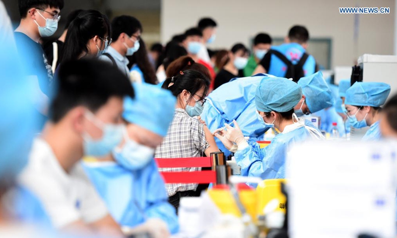 Faculty members and students receive COVID-19 vaccines at a vaccination site at Anhui Agricultural University in Hefei, east China's Anhui Province, May 13, 2021.Photo:Xinhua