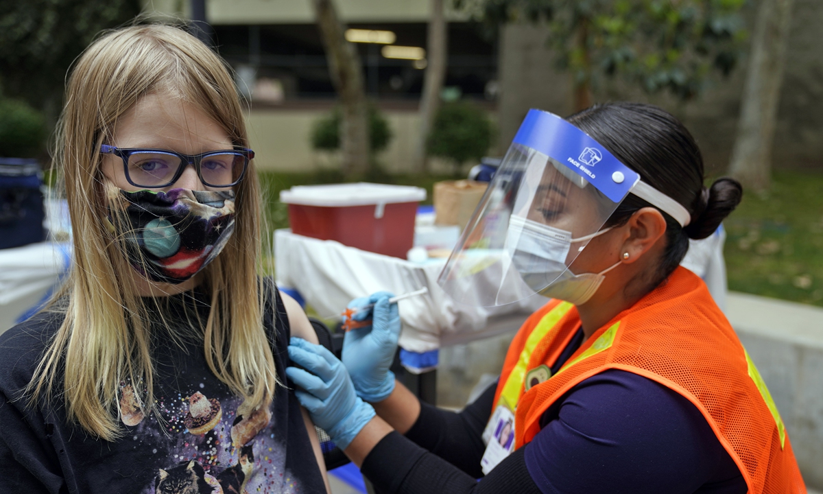 Oliver Comfort, 12, gets a shot of the Pfizer COVID-19 vaccine at the First Baptist Church of Pasadena Friday, May 14, 2021, in Pasadena, California, the US. Photo: VCG