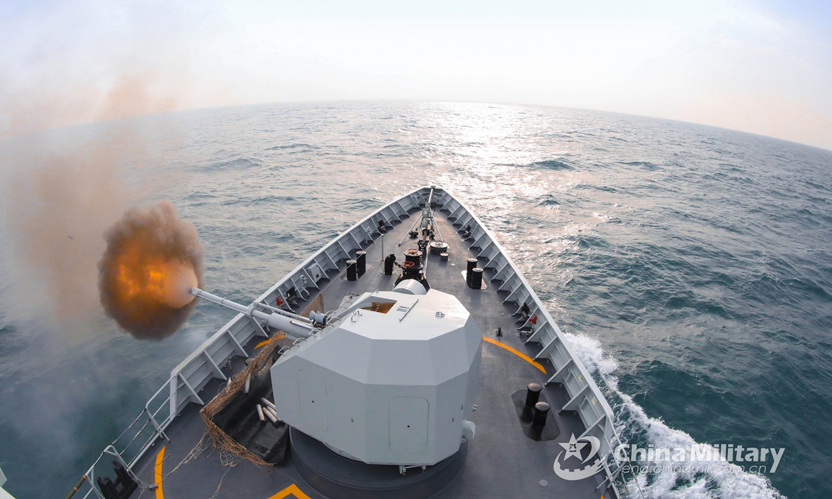Warship attached to a naval frigate flotilla under PLA's Southern Theater Command fires its main gun at mock sea targets during a maritime combat training exercise on April 21, 2021. Photo: China Military Online