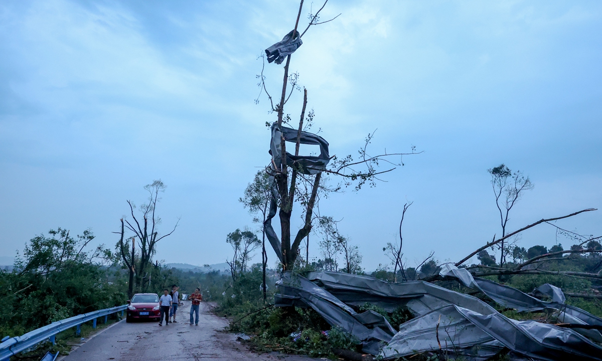 A magnitude-9 tornado broke out in Central China's Wuhan's Caidian district on Friday, damaging some houses in the village, breaking a large number of trees and collapsing some sheds. Photo: VCG
