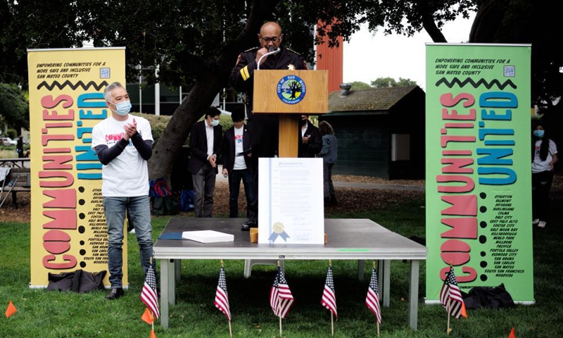 A senior police officer speaks at a rally against racism and hate crimes in San Mateo, California, the United States, May 15, 2021. A few hundred people including government officials and local residents from several cities in San Mateo participated in the rally on Saturday, calling for all cities and communities to unite and to stop racism and hate crimes. Photo: Xinhua