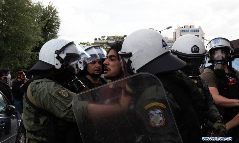 Members of riot police are seen making an arrest at a demonstration, in Athens, Greece, on May 15, 2021. Hundreds of Greeks and Palestinians that live in Greece protested on Saturday outside the Israel's embassy in Athens against Israeli attacks on Gaza.(Photo: Xinhua)