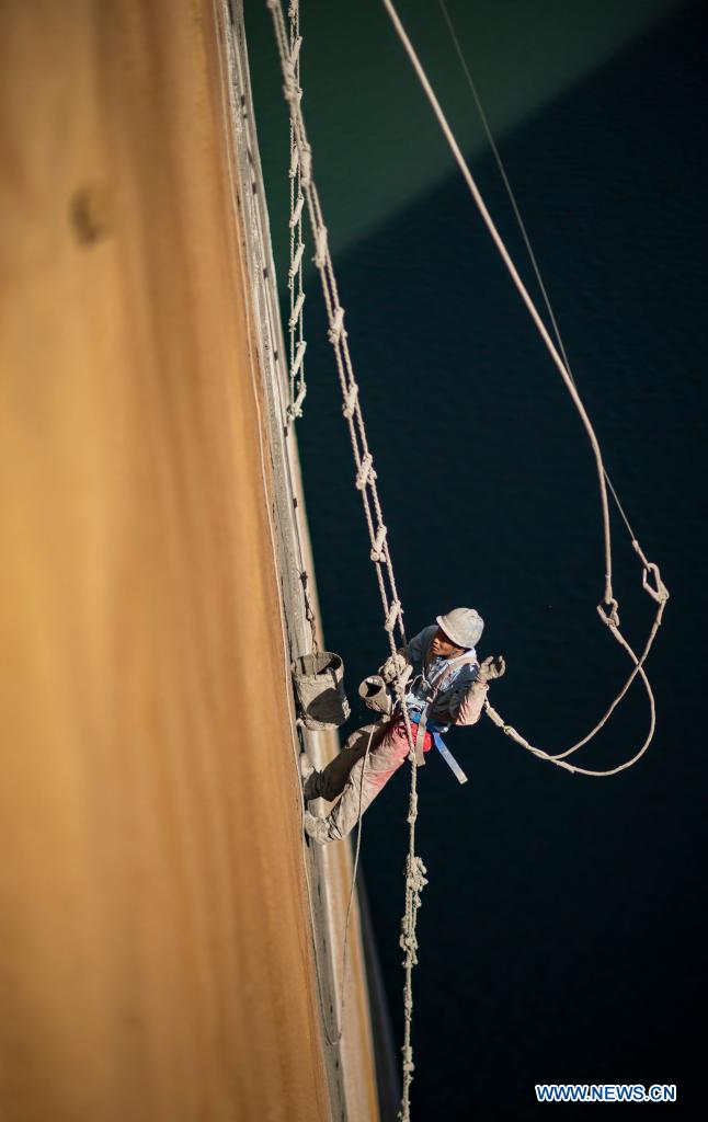 A man works at the construction site of the Baihetan hydropower station in southwest China, May 13, 2021. Baihetan on the Jinsha River, the upper section of the Yangtze, straddles the southwest provinces of Yunnan and Sichuan. With a total installed capacity of 16 million kilowatts, it is the second-largest hydropower station in China in terms of installed capacity, second only to the Three Gorges Dam project in the central province of Hubei.(Photo: Xinhua)