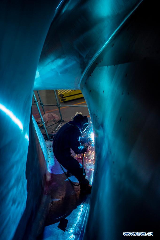 A man works at the construction site of the Baihetan hydropower station in southwest China, May 14, 2021. Baihetan on the Jinsha River, the upper section of the Yangtze, straddles the southwest provinces of Yunnan and Sichuan. With a total installed capacity of 16 million kilowatts, it is the second-largest hydropower station in China in terms of installed capacity, second only to the Three Gorges Dam project in the central province of Hubei.(Photo: Xinhua)