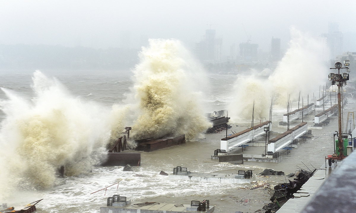 Waves lash a shoreline in Mumbai on Monday, as Cyclone Tauktae, packing ferocious winds and threatening a destructive storm, bore down on India, disrupting the country's response to its COVID-19 outbreak. Photo: AFP