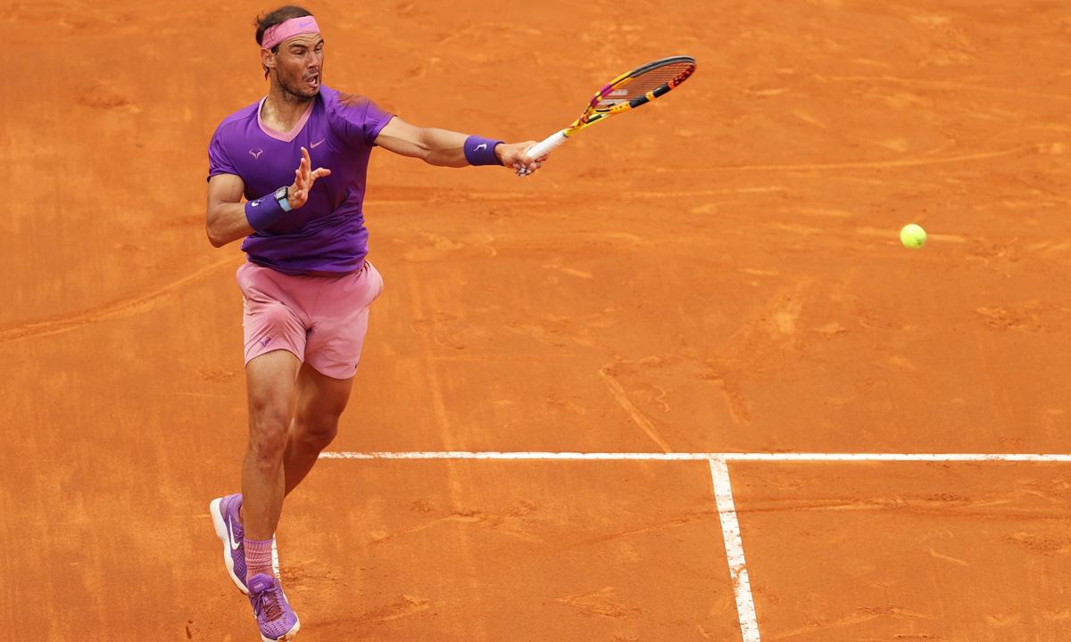 Rafael Nadal hits a forehand to Novak Djokovic on Sunday in Rome, Italy. Photo: VCG