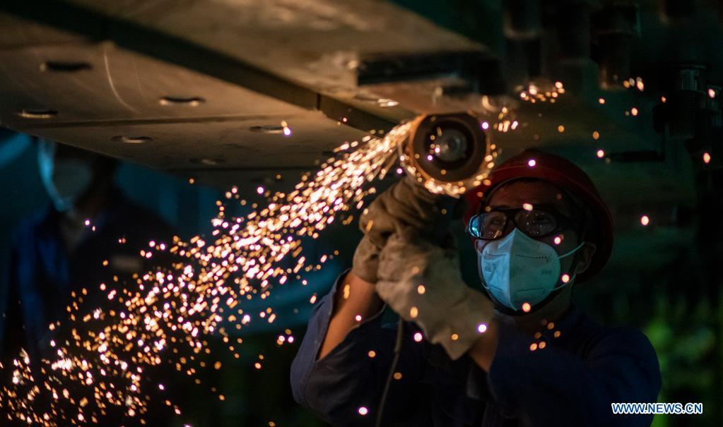 A man works at the construction site of the Baihetan hydropower station in southwest China, May 14, 2021. Baihetan on the Jinsha River, the upper section of the Yangtze, straddles the southwest provinces of Yunnan and Sichuan. With a total installed capacity of 16 million kilowatts, it is the second-largest hydropower station in China in terms of installed capacity, second only to the Three Gorges Dam project in the central province of Hubei.(Photo: Xinhua)
