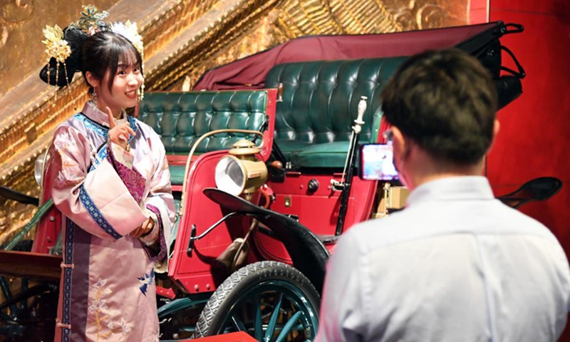Zeng Hongjuan (L) introduces car collections to the audience by telling stories via livestreaming at Beijing Auto Museum in Beijing, capital of China, May 18, 2020.(Photo: Xinhua)