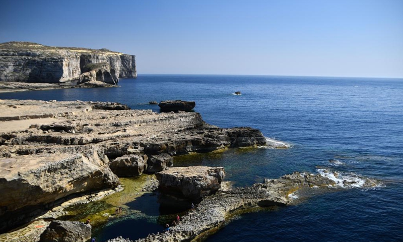 Photo taken on May 17, 2021 shows Dwejra Bay in Gozo, Malta. The Dwejra Bay is where the natural Azure Window once stood. The natural arch collapsed in 2017.(Photo: Xinhua)