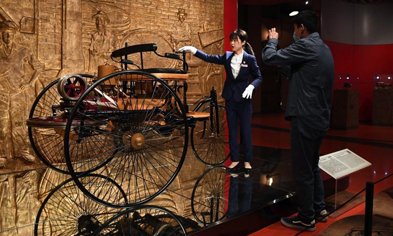 Zeng Hongjuan (L) introduces car collections to the audience via livestreaming at Beijing Auto Museum in Beijing, capital of China, April 30, 2020. Zeng Hongjuan, who was born in the 1990s, is a tour guide at the Beijing Auto Museum.(Photo: Xinhua)