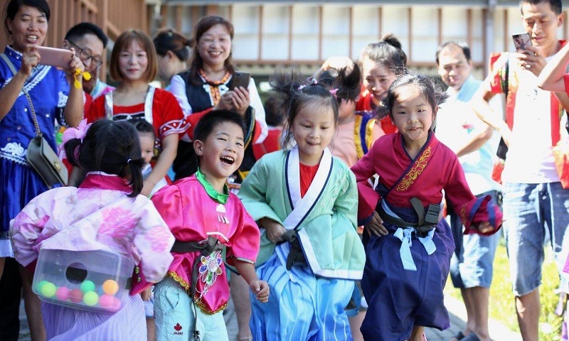 Children play games at the New Residents Festival held in August 2020 in Fuxi subdistrict of Deqing in East China's Zhejiang Province. Photo: Courtesy of Fuxi subdistrict