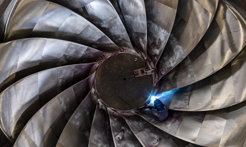 Aerial photo shows a man working at the construction site of the Baihetan hydropower station in southwest China, May 14, 2021.(Photo: Xinhua)