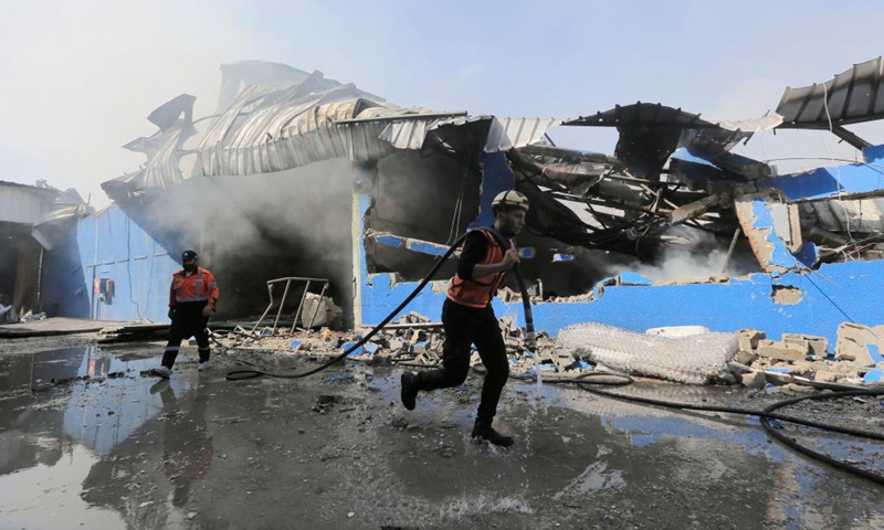A Palestinian firefighter extinguishes a fire after an Israeli airstrike in Gaza City, on May 17, 2021.(Photo: Xinhua)