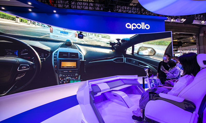 Visitors experience the autonomous driving system of Baidu Apollo at the Shanghai Auto Show, April 19, 2021. Photo: VCG