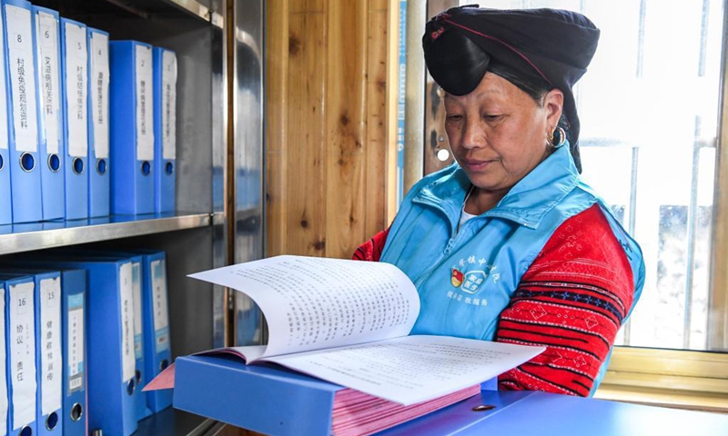 Pan Jiping arranges villagers' health records at Xiaozhai Village of Longji Township, Longsheng County, south China's Guangxi Zhuang Autonomous Region, May 18, 2021. In Xiaozhai, a village at the foot of Fupingbao Mountain over 1,900 meters above sea level, Pan Jiping has been a country doctor here for more than 30 years.(Photo: Xinhua)