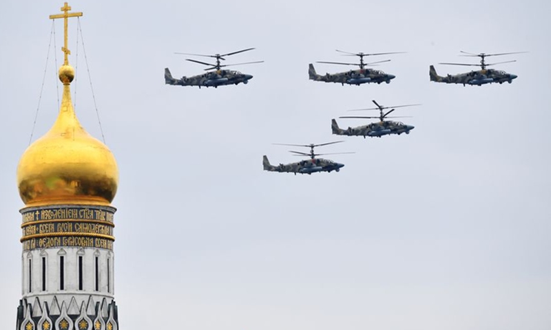 Russian Ka-52 Alligator attack helicopters fly in formation during a Victory Day air parade rehearsal over Moscow, Russia, May 4, 2020. (Photo:Xinhua)