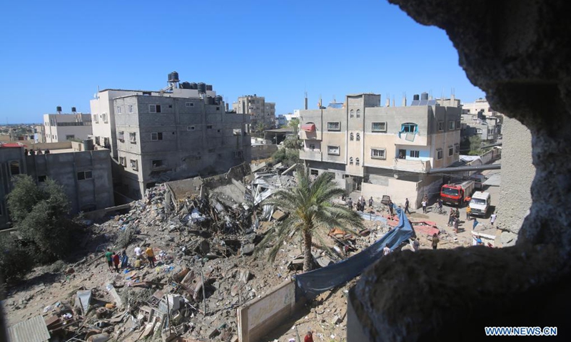 Palestinians inspect a destroyed house after an Israeli airstrike in the southern Gaza Strip city of Rafah, on May 19, 2021. Five Palestinians, including a local journalist, were killed on Wednesday in a fresh round of Israeli airstrikes on the Gaza Strip that have been going on for 10 days, medics said.(Photo: Xinhua)
