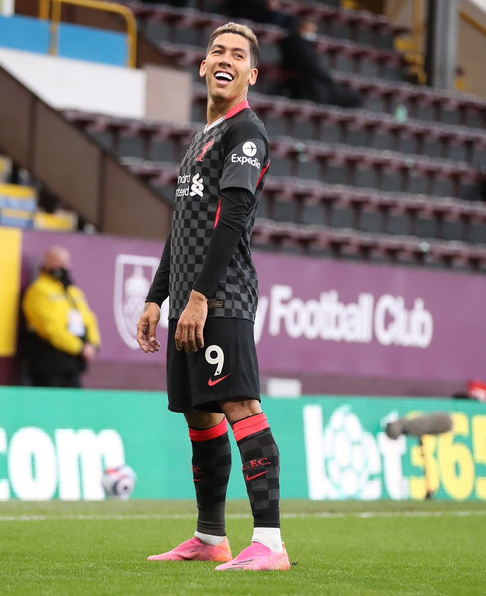 Roberto Firmino of Liverpool celebrates after scoring their side's first goal against Burnley on Wednesday in Burnley, England. Photo: VCG