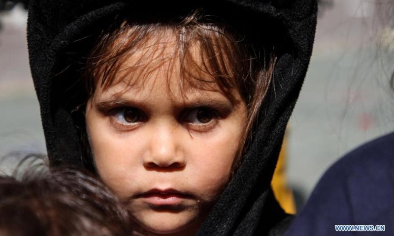 Palestinian girl Jaleya Al-Attar poses for a photo at a school in Gaza City, on May 19, 2021. She fled her home after it was damaged during Israeli air strikes, and took refuge at the school as many other Palestinians.(Photo: Xinhua)
