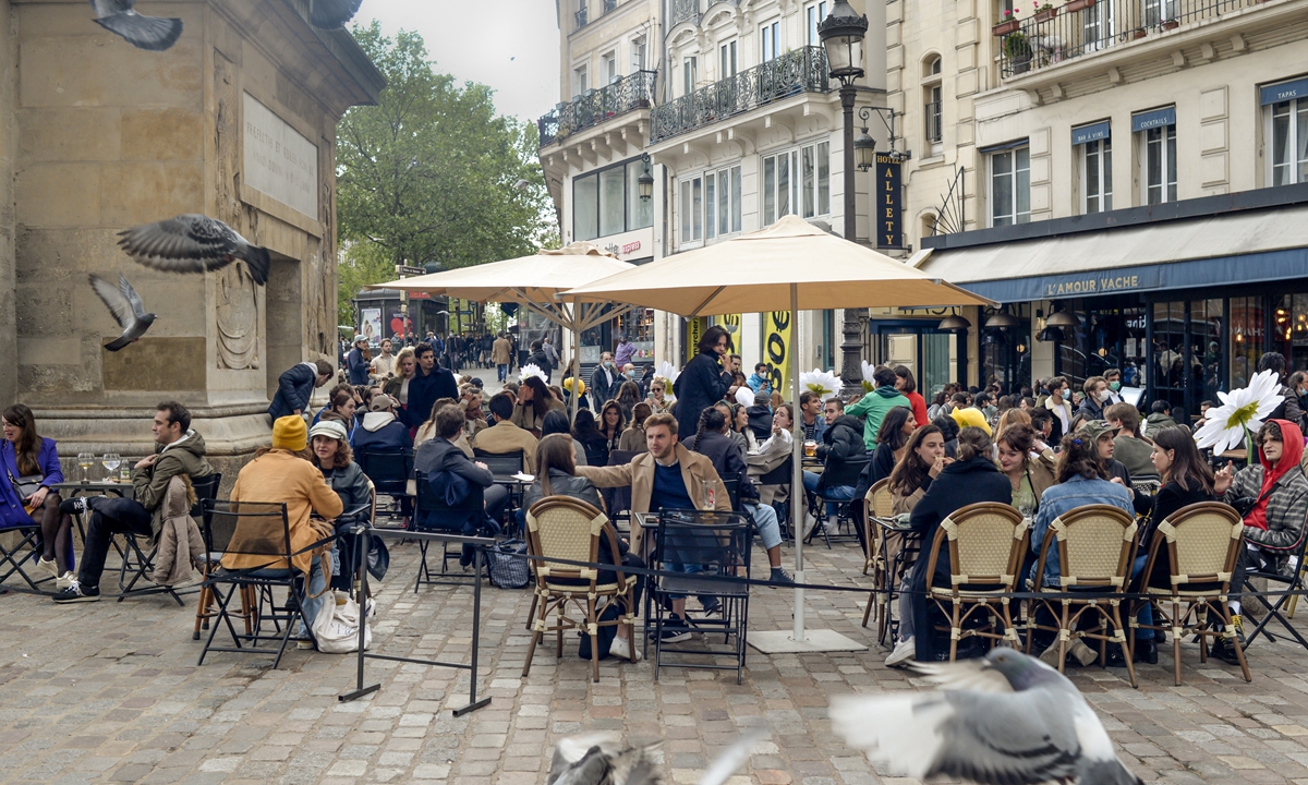 France savors new freedoms as cafes, museums reopen