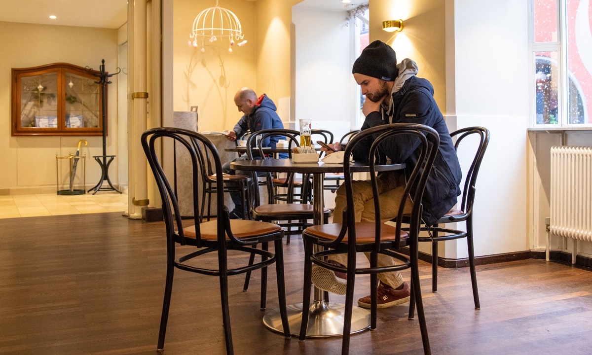 Guests sit at a cafe in Austria on March 15. Photo: AFP
