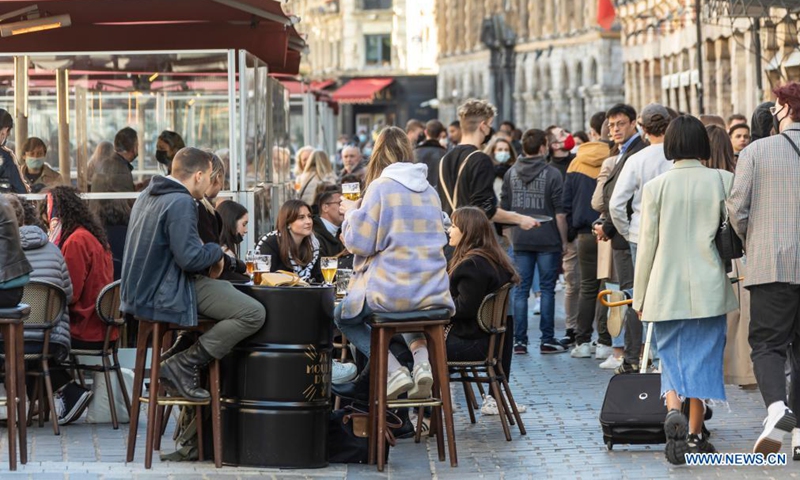 People are seen at a terrace of a bar in Lille, northern France, May 19, 2021. France on Wednesday took an important step forward towards returning to normality as people in the country can once again meet up in cafes or enjoy a meal in restaurants, which are now allowed to open their terraces.(Photo:Xinhua) 
