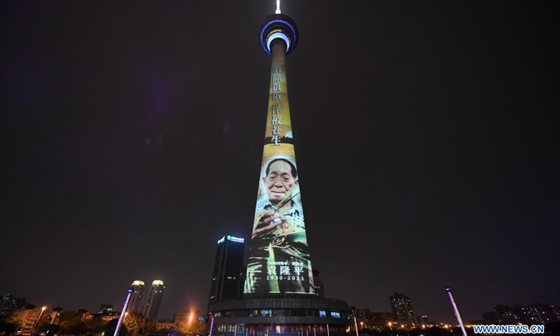 A landmark is lit up in remembrance of Yuan Longping in north China's Tianjin, May 22, 2021. Chinese scientist Yuan Longping, renowned for developing the first hybrid rice strain that relieved countless people of hunger, died of organ failure at 91 on Saturday.(Photo: Xinhua)