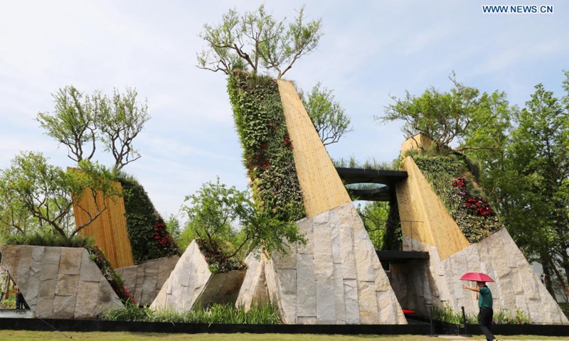 A man visits the 10th China Flower Expo in east China's Shanghai, May 21, 2021. The 10th China Flower Expo opened here on Friday, welcoming over 20,000 visitors on its first day. The expo, held to showcase the development of China's flower industry, will last until July 2. A total of 180 outdoor exhibition zones and 64 indoor areas have been set up at the expo park in the city's Chongming District.(Photo: Xinhua)