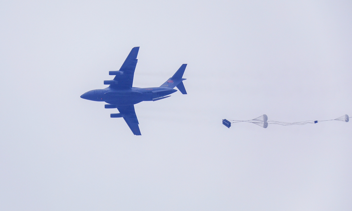 Heavy equipment is dropped from a transport aircraft attached to an airborne brigade under the PLA Air Force in the heavy equipment airdrop training on April 26, 2021. Photo: China Military Online